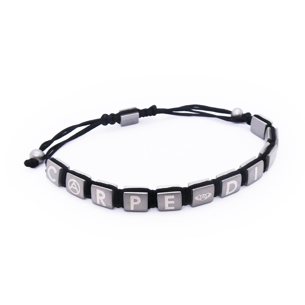 Black and silver bracelet with letter blocks spelling 'Carpe Diem' on a string. Stylish accessory for everyday wear.