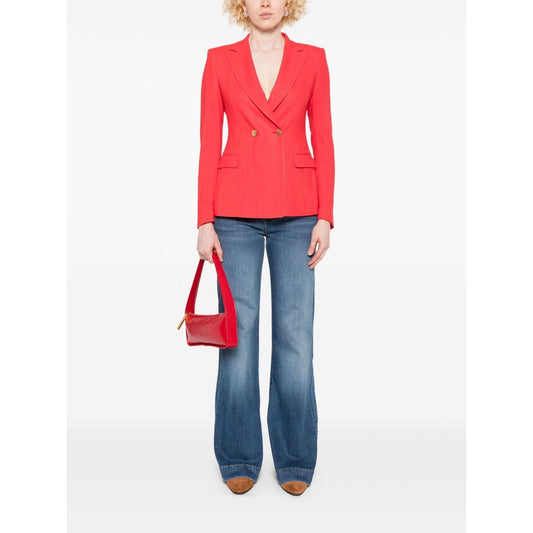 Woman wearing Seven Jeans Blue wide-leg denim with red blazer and handbag