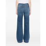 Back view of Seven Jeans Blue wide-leg denim with belt loops, slash and patch pockets, showcased on a model. Fashionable and versatile.