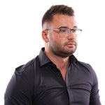 Man wearing Hackett Blue Men Glasses Frame with metal and plastic material, full-rim browline style, in a blue color.