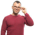 Man wearing Sandro Brown Men Glasses Frame, plastic full-rim design, smiling in a red sweater against white background.