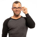 Man wearing Lozza Blue Unisex Glasses Frame, full-rim oval style with blue frame and demo lenses.