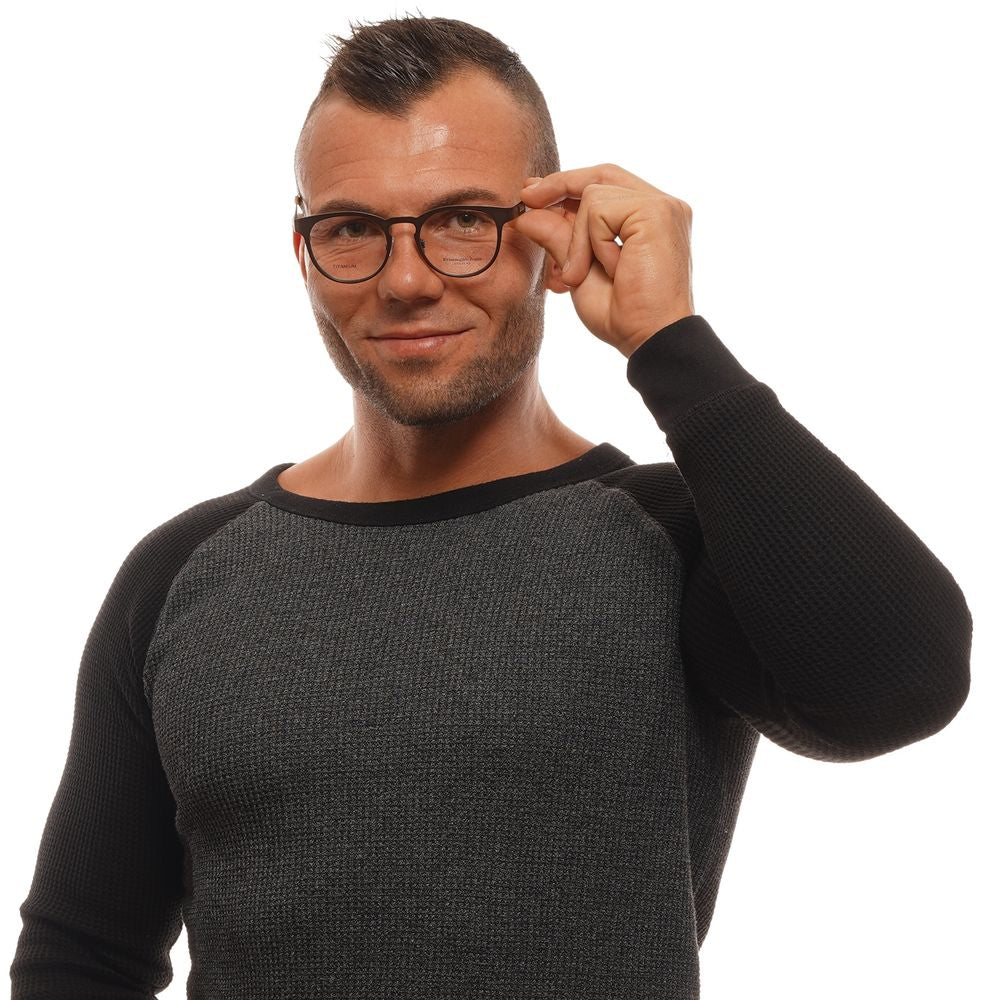 Man wearing Ermenegildo Zegna Bronze Men Glasses Frame, adjusting full-rim titanium glasses, stylish and modern eyewear for men.