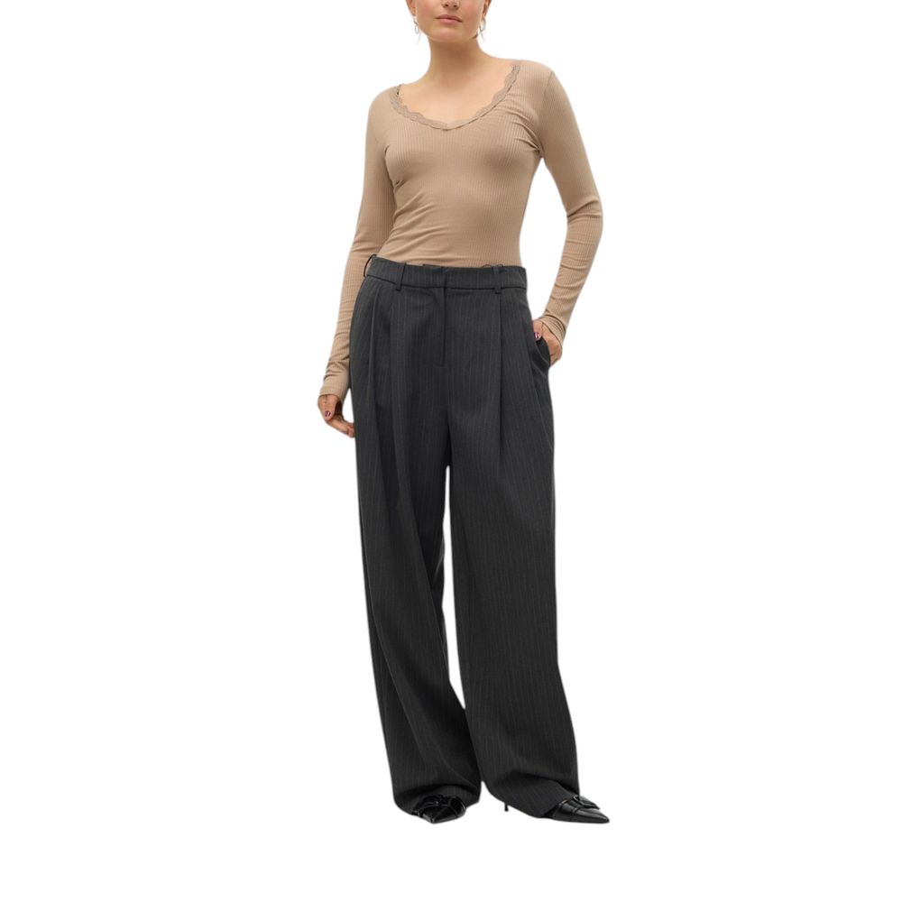 Woman wearing Vero Moda gray wide-leg pinstripe pants in polyester blend, showcasing a sophisticated and professional style.