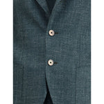 Detail of Gi Capri Virgin wool Suit blazer with button closure and welt patch pockets.