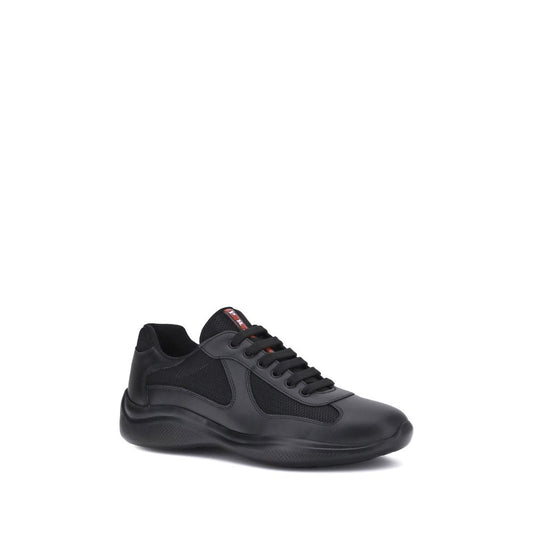 Prada America's Sneakers in black with leather and fabric panels, featuring lace-up closure and textured sole for comfort and style.