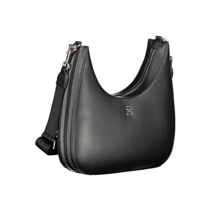 Tommy Hilfiger Black Polyester Handbag with adjustable shoulder strap, internal pocket, logo, contrasting details, and zip closure.