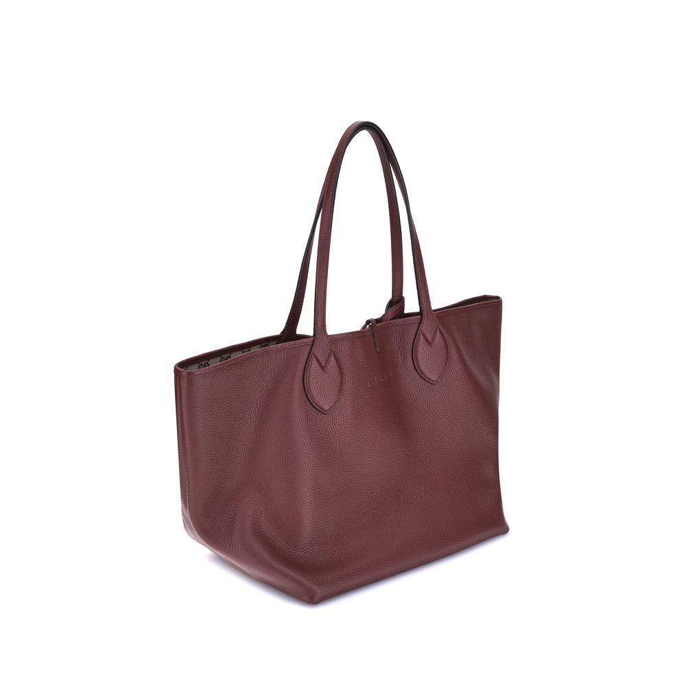 Front view with bag zipped and handles upright.