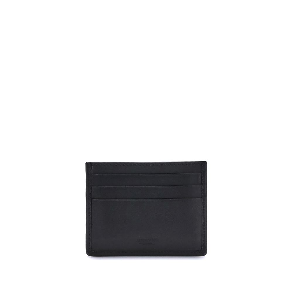 Ferragamo Black Calf Leather Bos Taurus Wallet with Gancini Card Holder, featuring palladium-finish and suede insert.