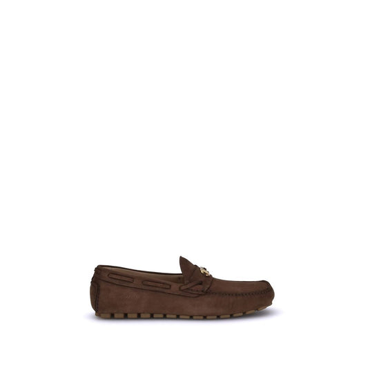 Valentino Garavani Brown Rubber Slip-On Loafers with VLogo plaque and notched sole for comfort and grip.