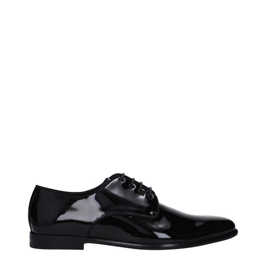 Dolce & Gabbana Black Leather Oxfords And Derbies with patent shiny finish, lace-up closure, pointy toe, leather sole, and low flat heel.