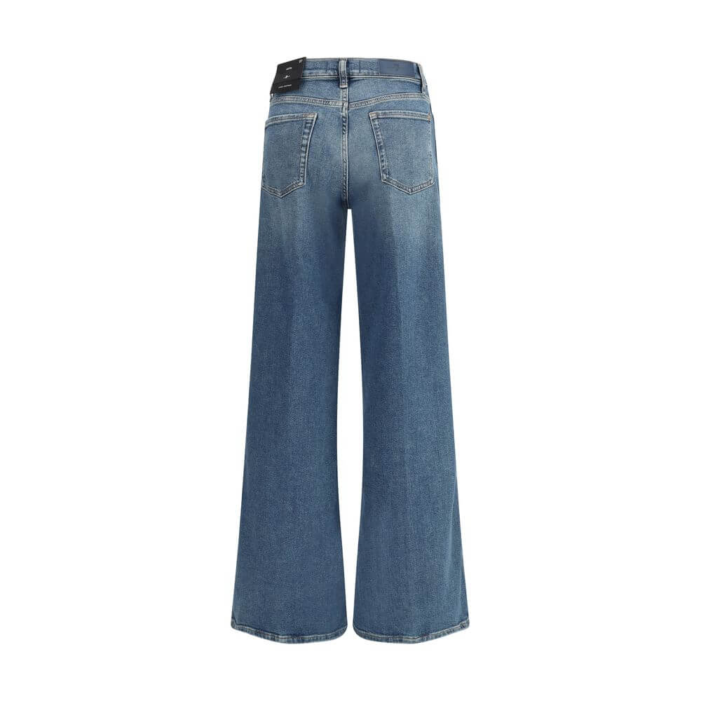 Back view of 7FOR Blue Cotton Flared Jeans showcasing wide legs and high waist in vintage denim with classic five-pocket style.