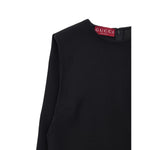 Gucci Black Wool Dress with sleeveless design and round neckline, showcasing zipper detail and fabric pleat stitching on side view.