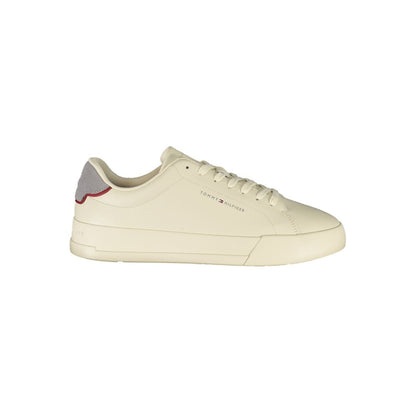 Tommy Hilfiger Beige Leather Men Sneaker with grey accents and logo, side view on white background
