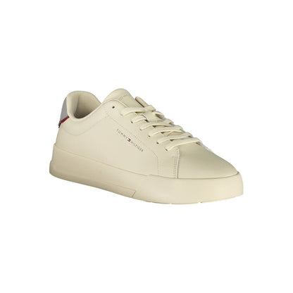 Tommy Hilfiger Beige Leather Men Sneaker with removable footbed and iconic logo, featuring a sleek sporty design with grey accents.