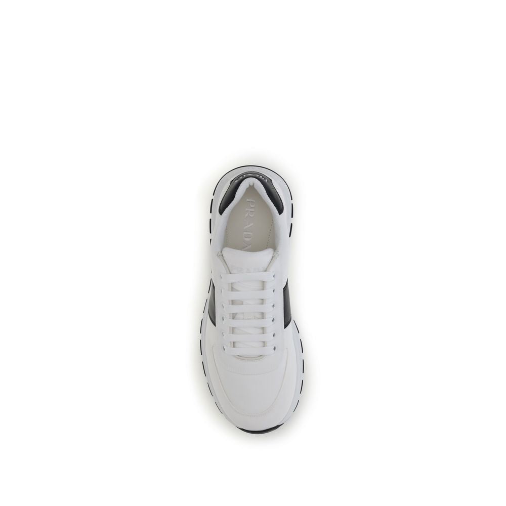 Prada Leather Sneakers in white, top view showing lace-up closure and logo detail, made from calf leather with reinforced toe and rubber sole.