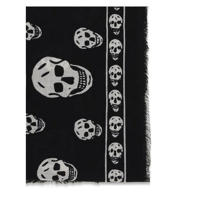Alexander McQueen Black Modal Scarf featuring skull motifs and fringed edges, made from silk and modal blend, AW25 season accessory.
