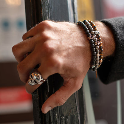 AN JEWELS JEWELRY Mod. AA.P255RBR bracelet and ring on a man's hand leaning against a window