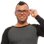 Man wearing BMW Blue Men Optical Frames with full-rim trapezium design and blue metal-plastic frame, showcasing stylish eyewear.