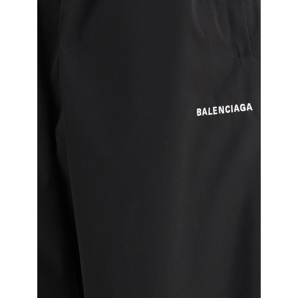 Balenciaga Black Polyester Casual Pants with logo detail, featuring a stylish wide-leg design and elasticized waistband for comfort and style.