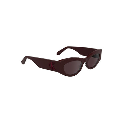Calvin Klein Red Acetate Women Sunglasses with cat-eye shape and brown lenses, made from eco-friendly bio-acetate for bold elegance.