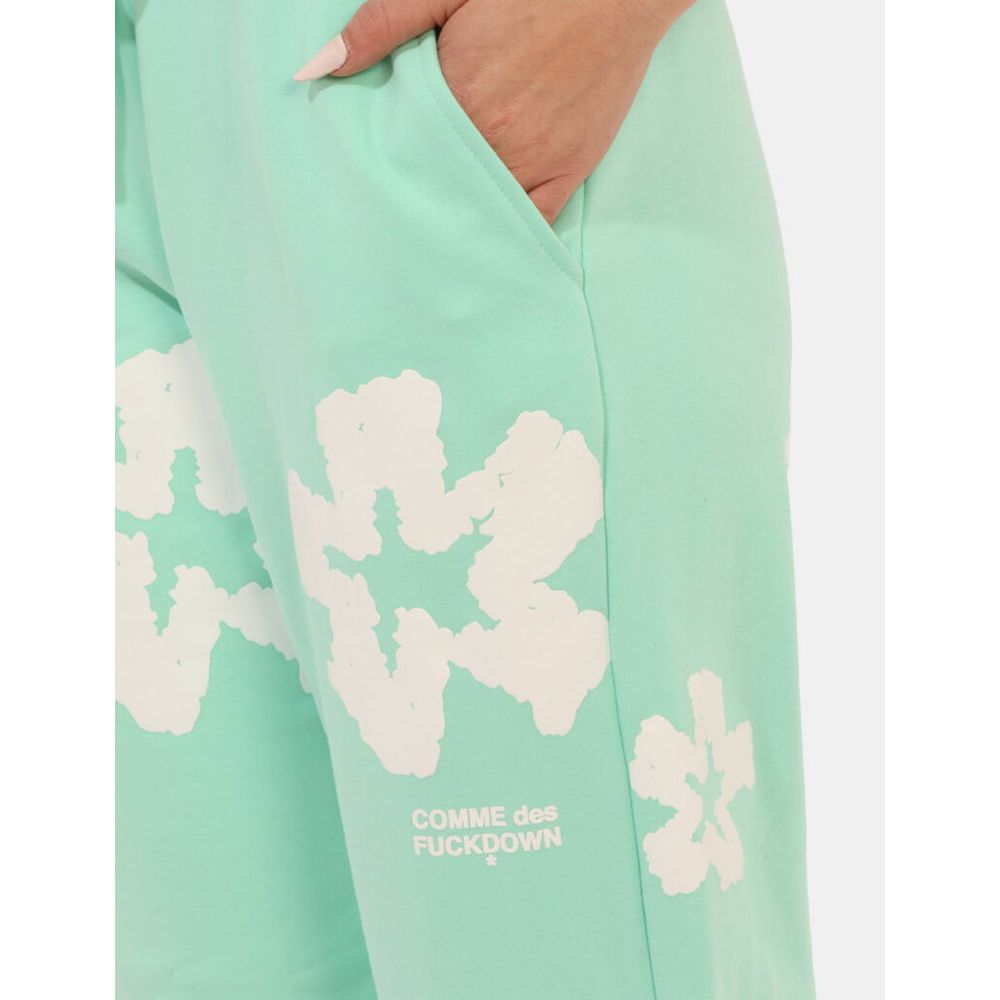 alt_tag: Comme Des Fuckdown Green Cotton Jeans & Pant with logo prints and pocket detail, elastic waistband with drawstring.