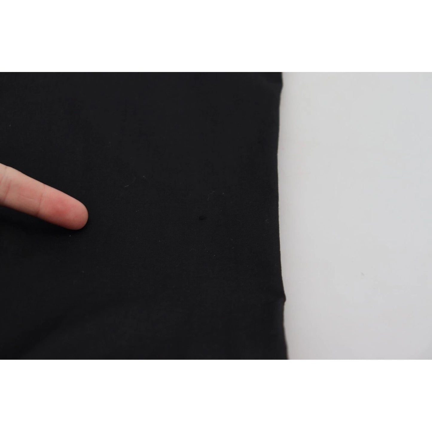 Close-up of Dolce & Gabbana Black High Waist Skinny Trouser STAFF Pants showing fabric texture and pulled threads.