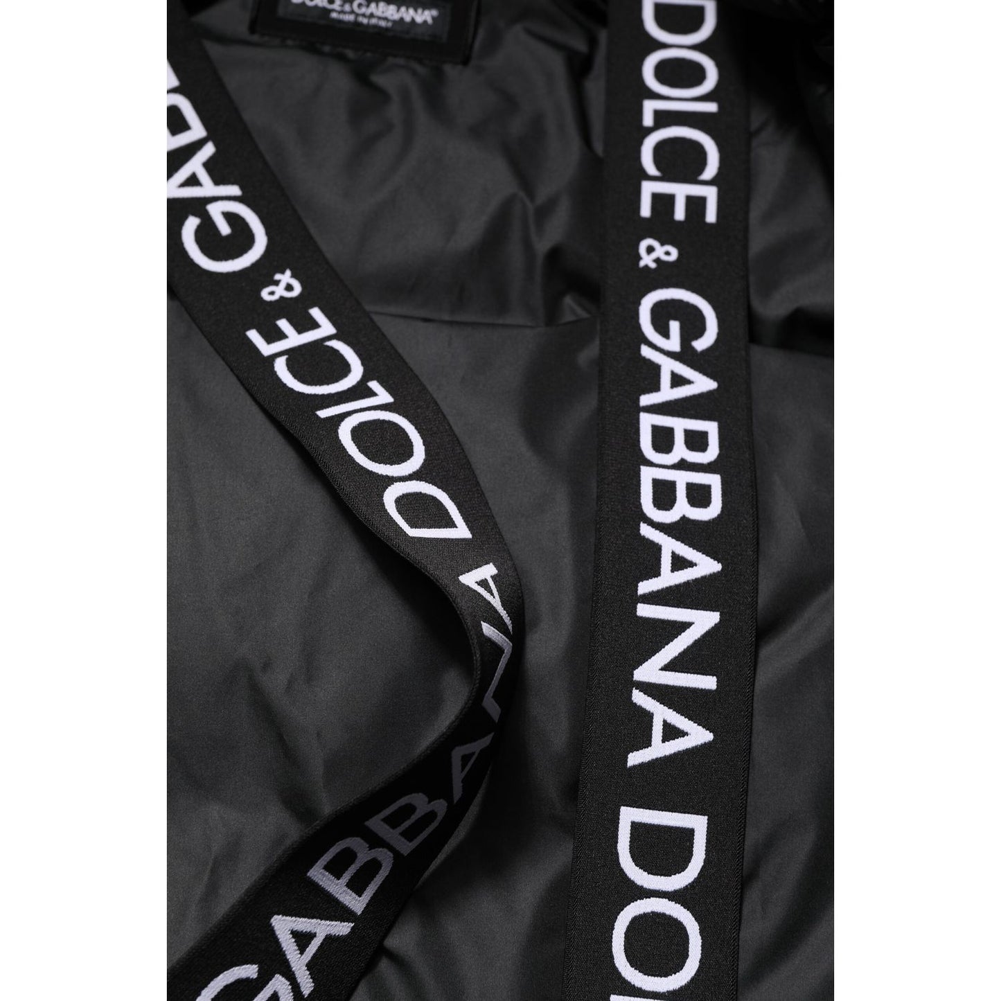 Close-up of Dolce & Gabbana Black Logo Full Zip Hooded Quilted Jacket with logo details on straps.