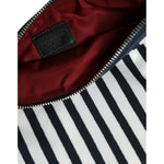 Interior view of Dolce & Gabbana Black White Striped Logo Plaque Clutch Pouch Bag with zipper closure.