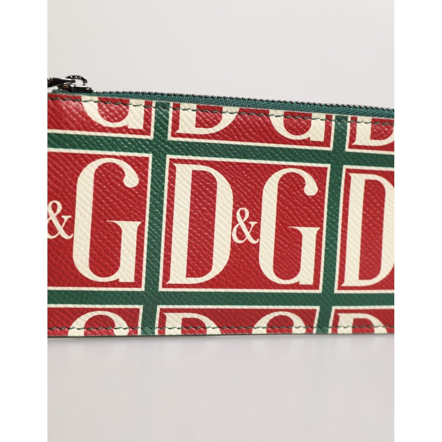 Dolce & Gabbana Green Calf Leather Logo Print Monogram Card Holder Wallet with red and green logo pattern close-up.