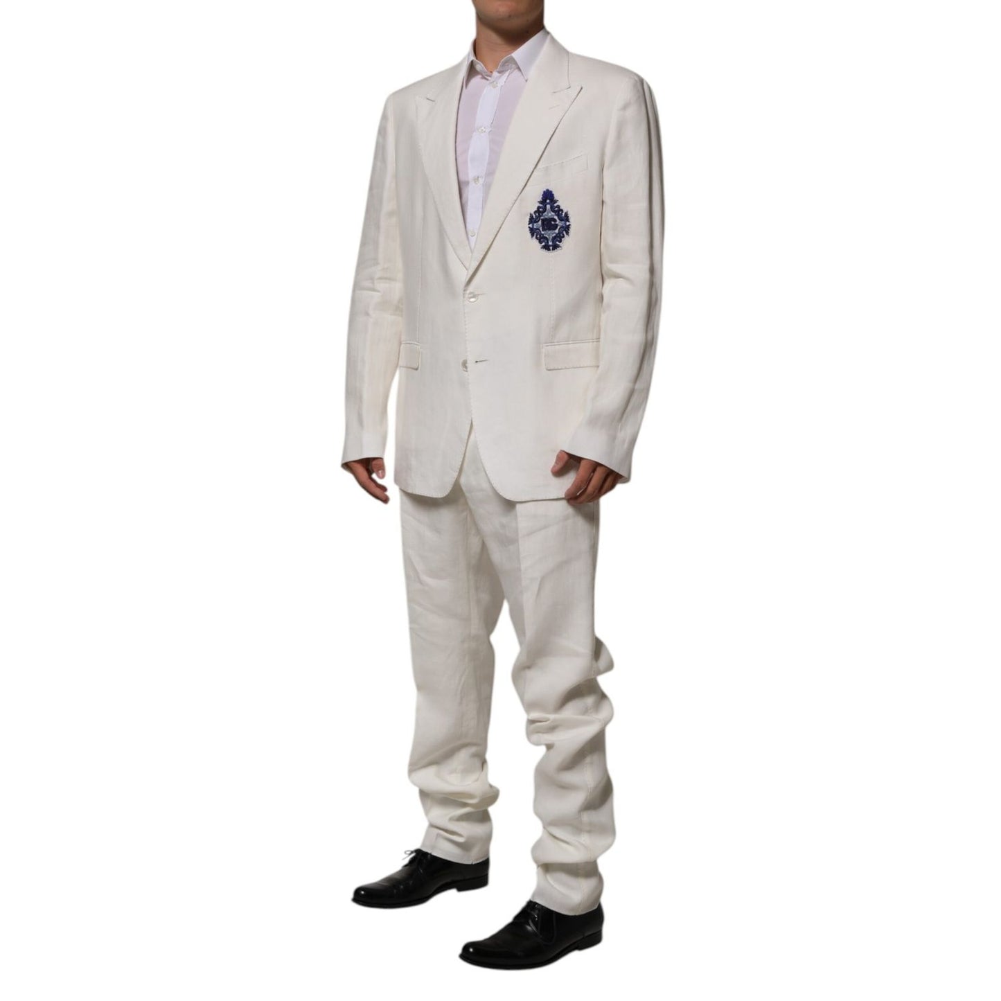 Dolce & Gabbana Light Cream Linen Embroidered 2 Piece Suit with DG crest patch, two-button closure, tailored fit, formal wear for luxury occasions.