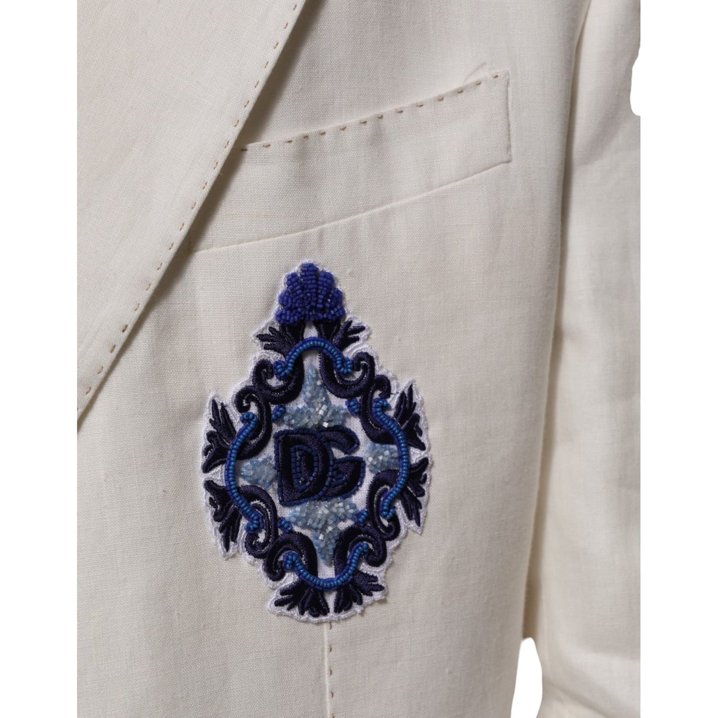 Close-up of the embroidered chest patch on Dolce & Gabbana Light Cream Linen Embroidered 2 Piece Suit.