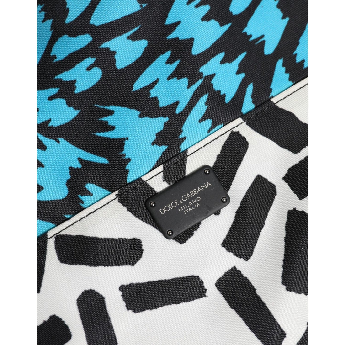 Close-up of Dolce & Gabbana Multicolor Printed Nylon Logo Plaque Men Clutch Pouch Bag showing logo plaque and bold print.