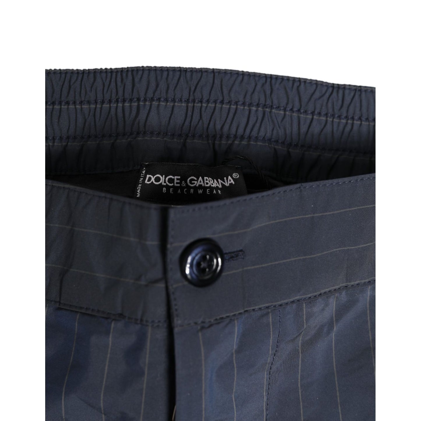 Close-up of Dolce & Gabbana Navy Blue Polyester Pinstripe Men Shorts Swimwear waistband with button detail.