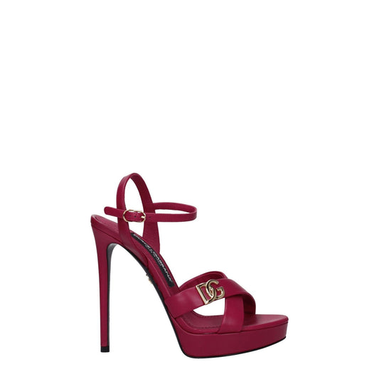 Dolce & Gabbana Pink Leather Platform Sandals with gold logo, high heel buckle closure, open toe, fuchsia leather.
