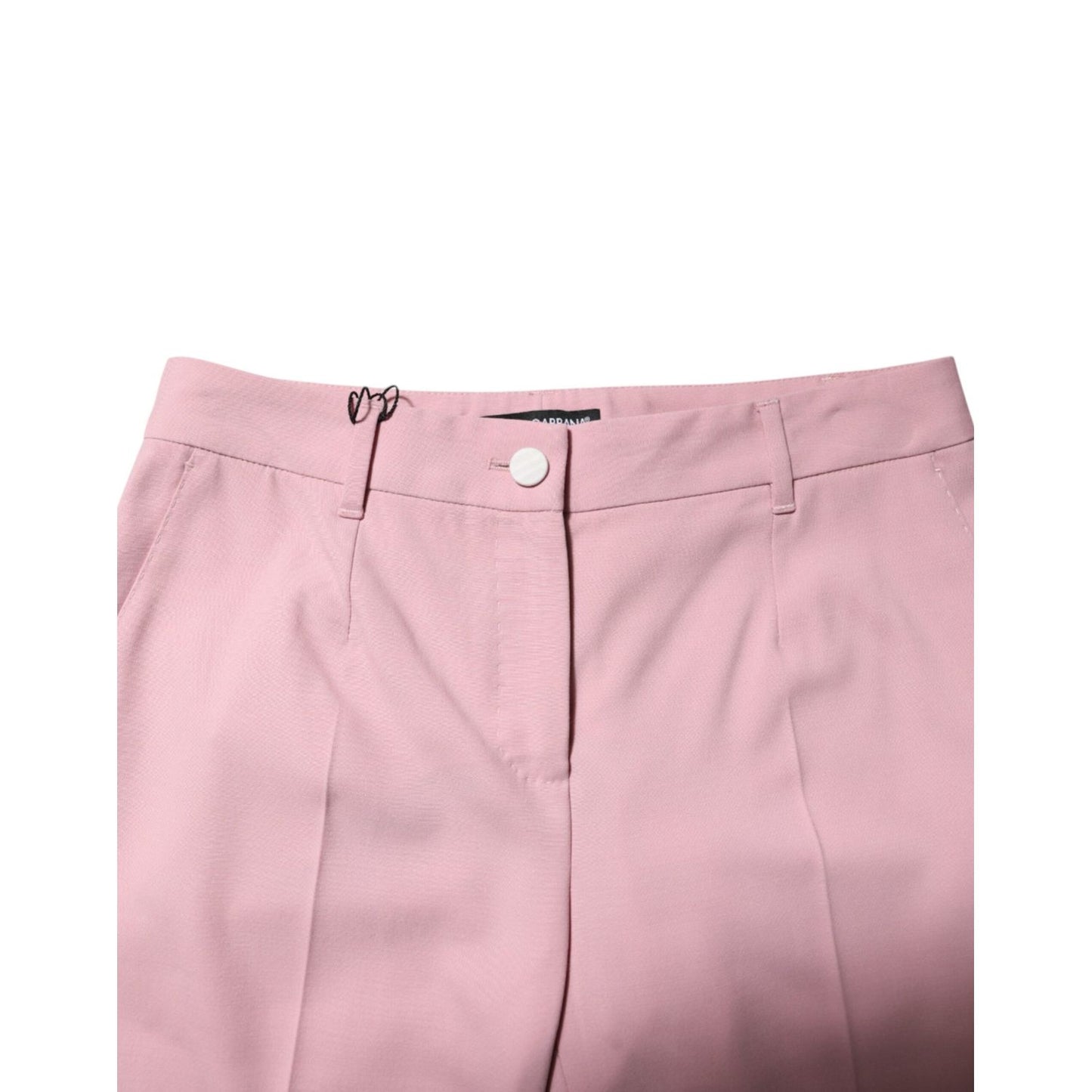 Dolce & Gabbana Pink Wool Mid Waist Tapered Pants with button closure, made in Italy, showcasing high craftsmanship and luxury design.