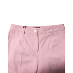 Dolce & Gabbana Pink Wool Mid Waist Tapered Pants with button closure, made in Italy, showcasing high craftsmanship and luxury design.