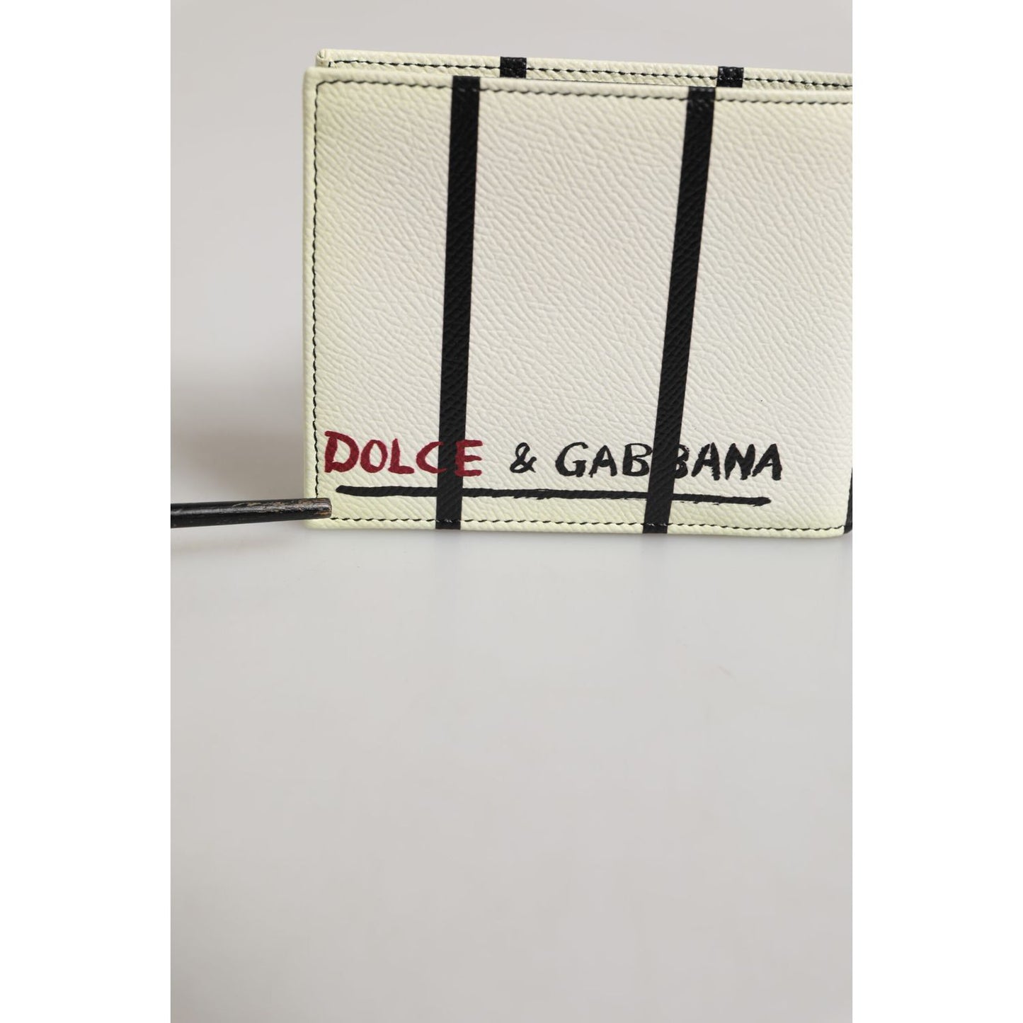 Dolce & Gabbana White Leather DG Crown Royals Bifold Card Holder Wallet with logo details in black and red on smooth leather background.