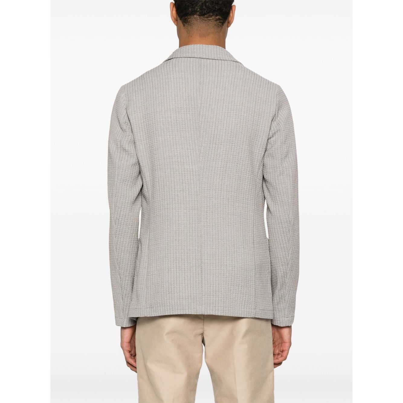 Back view of light grey Emporio Armani Jacket with high collar, featuring button fastening and side patch pockets in wool blazer style.