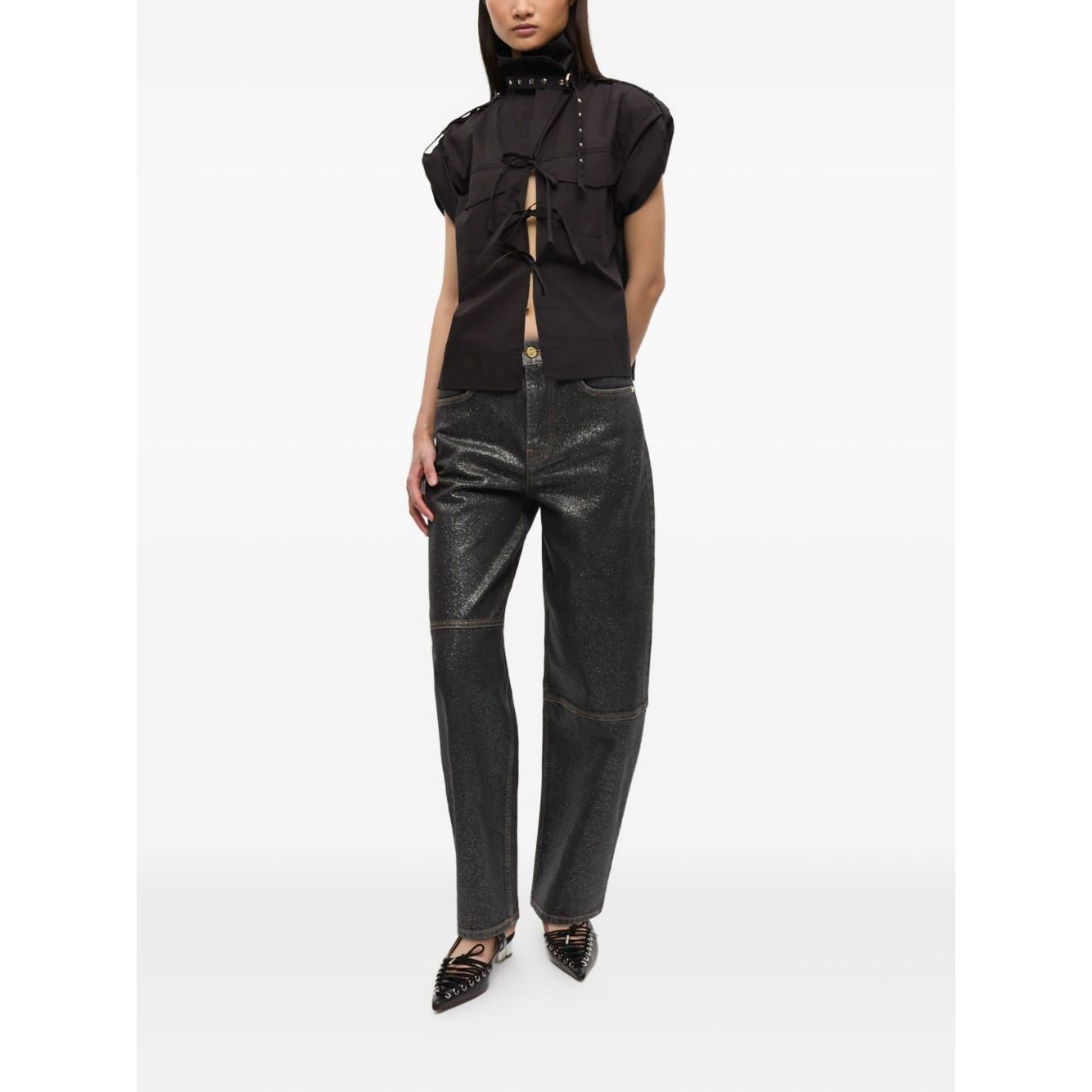 Alt Tag: Model wearing GANNI Jeans Black, featuring organic cotton denim, front button fastening, and classic five pockets design.