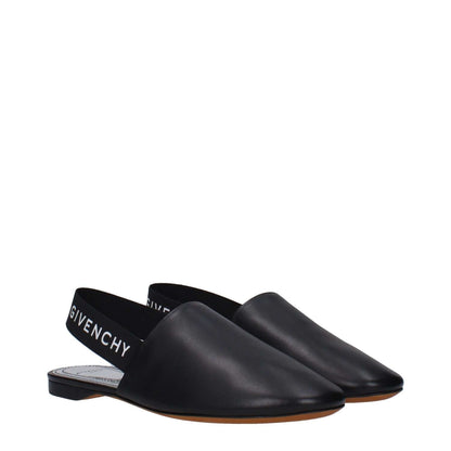 Givenchy Black Leather Mules with side and back logo, featuring round toe and low flat heel, made from premium leather. MPN BE2003E00H008.