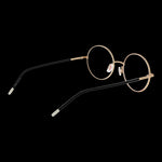 Lady's eyeglasses model HUGO MOD. HG 1240 512M2 with round gold frames and black temples, side view.