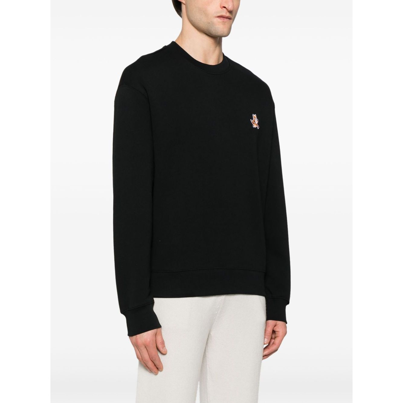 Maison Kitsuné Maison Kitsune speedy fox patch comfort sweatshirt in black, ribbed cuffs and hem, French terry lining, modeled in size M.