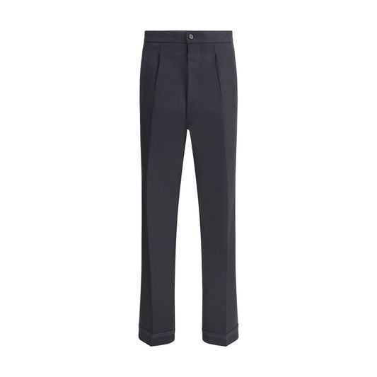 Margiela Black Wool Dress Pants with pleated front, turn-ups, and logo closure, featuring welt pockets and iconic topstitching detail.