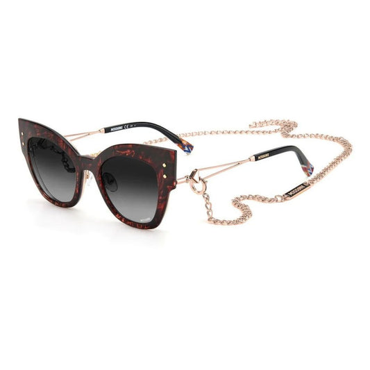 Fashionable cat-eye sunglasses with tortoiseshell frames and chain accessory.