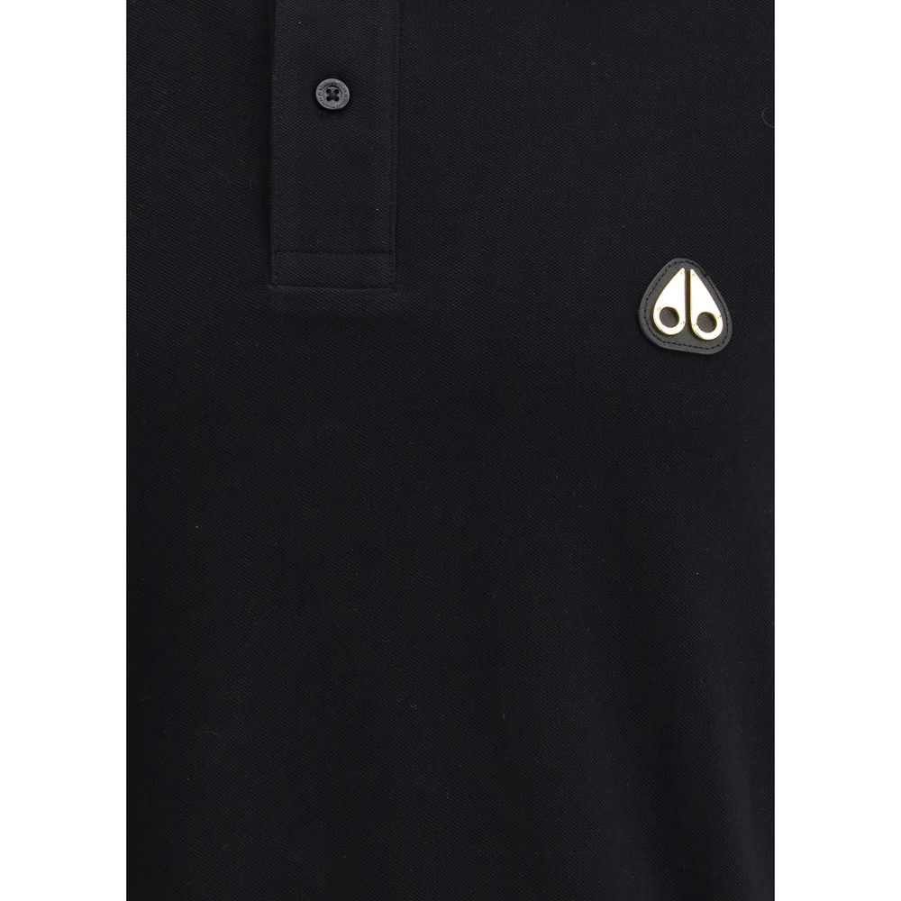 Moose Knuckles Black Cotton Polo Shirt with classic collar, button detail, and iconic logo patch for elegant sportswear style.