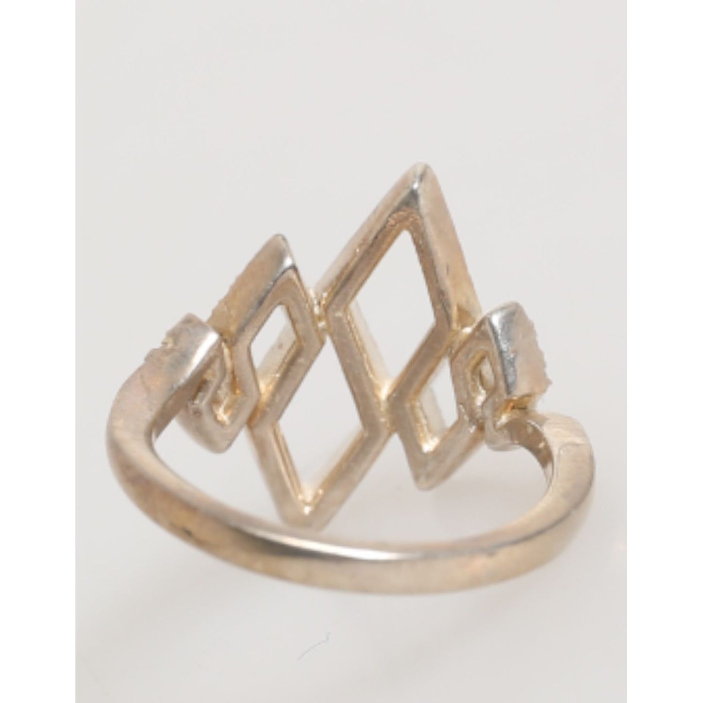 Elegant Nialaya Geometric Diamond Shape Pave CZ Crystal Jewelry Ring in 925 Silver with gold finish and CZ accents.