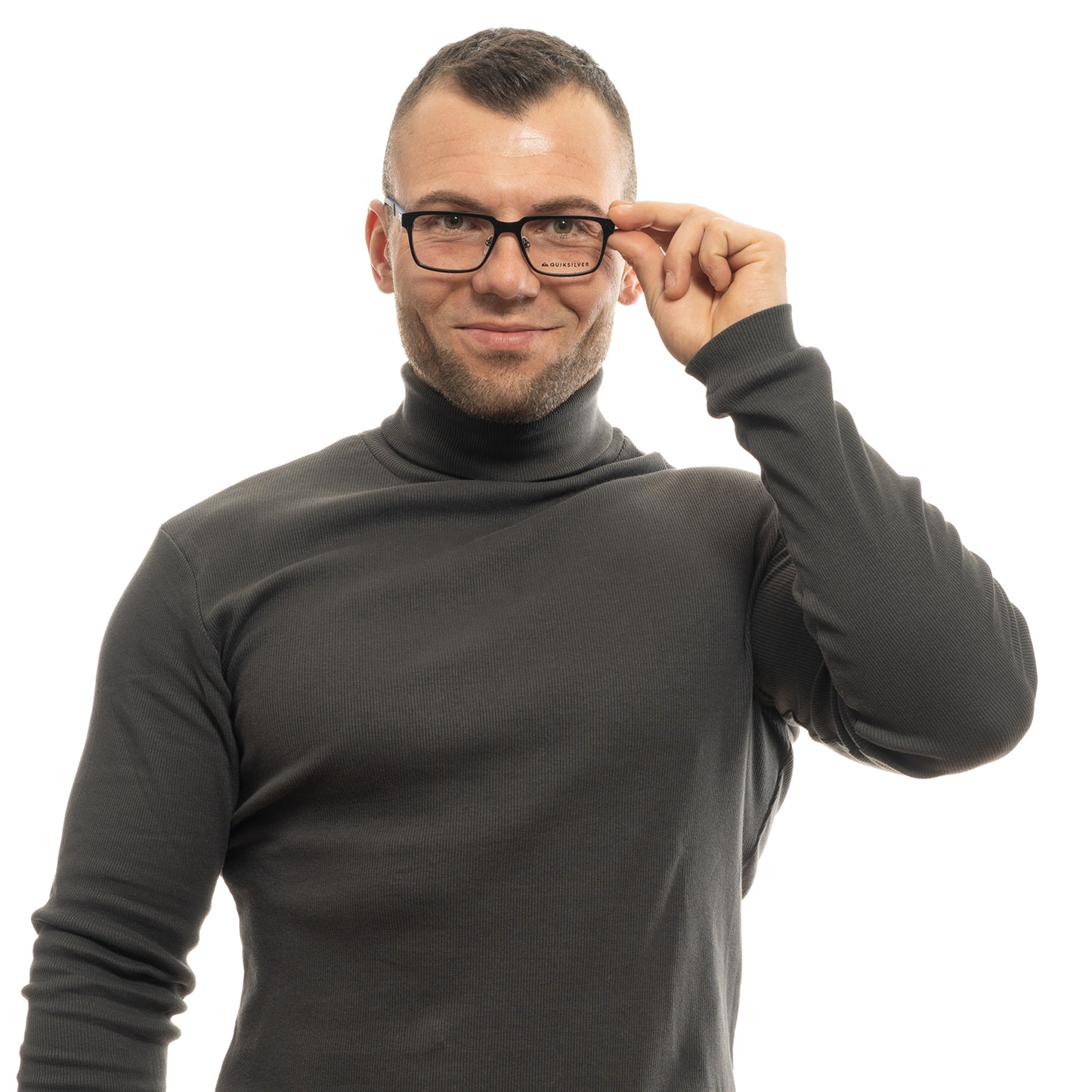 Person wearing glasses and a dark turtleneck, adjusting frames with a smile.
