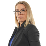 Businesswoman with glasses in a black blazer, confident professional portrait
