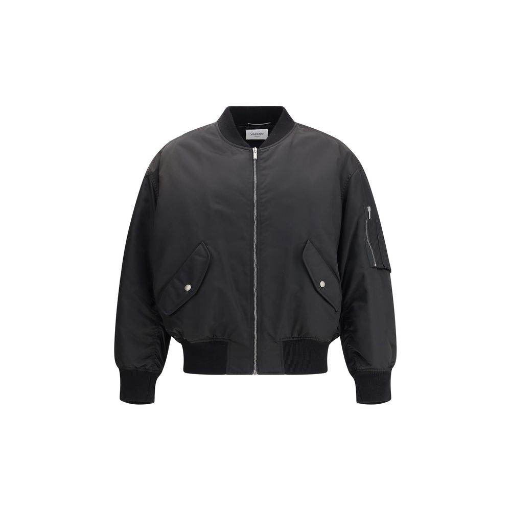 Saint Laurent Black Polyamide Bomber, oversized water-repellent jacket with zip closure, slanted flap pockets, and ribbed trim.